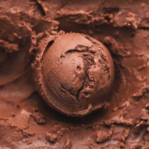 A scoop of chocolate sorbet laid on chocolate sorbet.