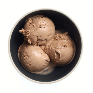 Chocolate-only ice cream scoops in a dark bowl, showing a smooth, slightly matte texture.
