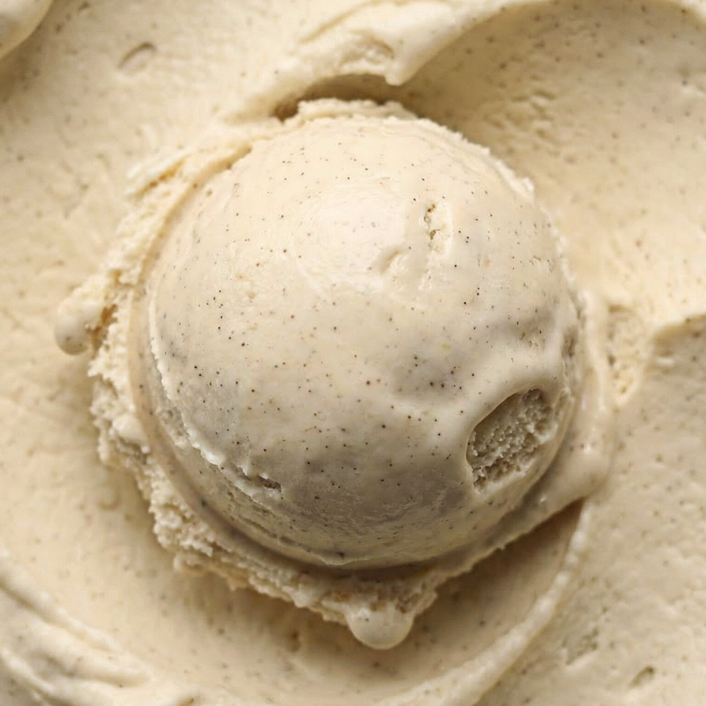 Close-up of a scoop of hazelnut ice cream with a smooth, creamy texture.