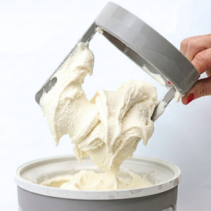 White chocolate ice cream made with xanthan gum being scooped from a tub